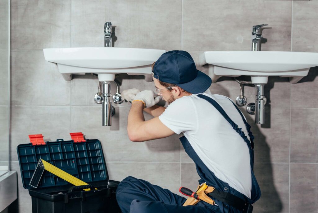 Young professional plumber